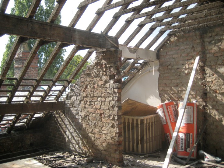 Top floor studio flat ripped out and ready for dormer window to be inserted to the left of the picture