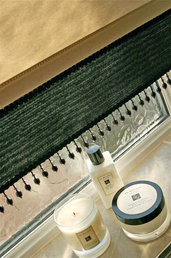 Finished roller blind complete with gorgeous beading and bathroom luxuries