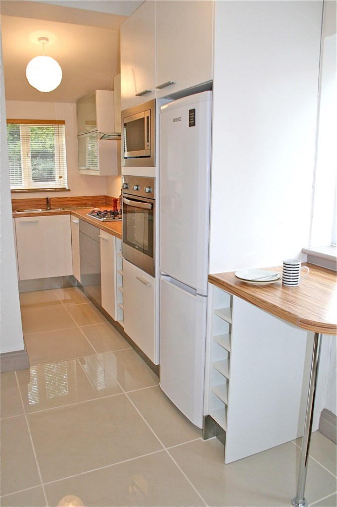 Manley Kitchen after 1 Ikea Applad units, a Zebrano laminate worktop, B&Q floor tiles
