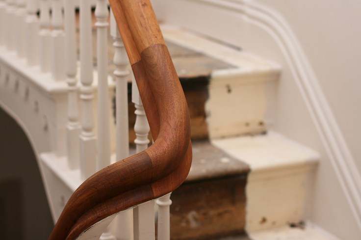 Stripped back banister in Victorian hallway