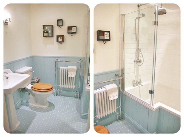 Blue pastel painted panelling in period style bathroom