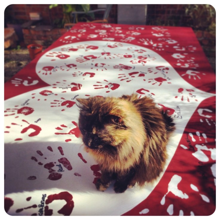 Cat sitting on chalk painted Heart Art