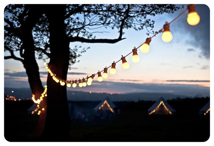 Glamping with field festoons via Lights4Fun