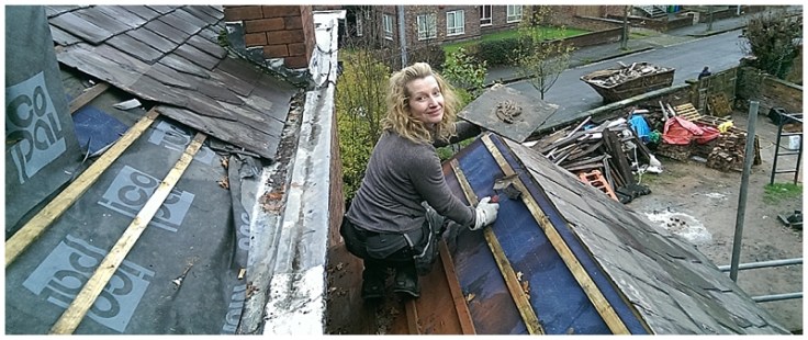 Lady builder on roof 