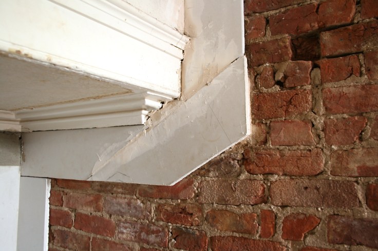 Framing exposed bare brick with plasterboard 