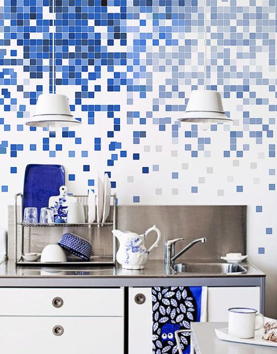 Blue and white pixel tiles on kitchen wall