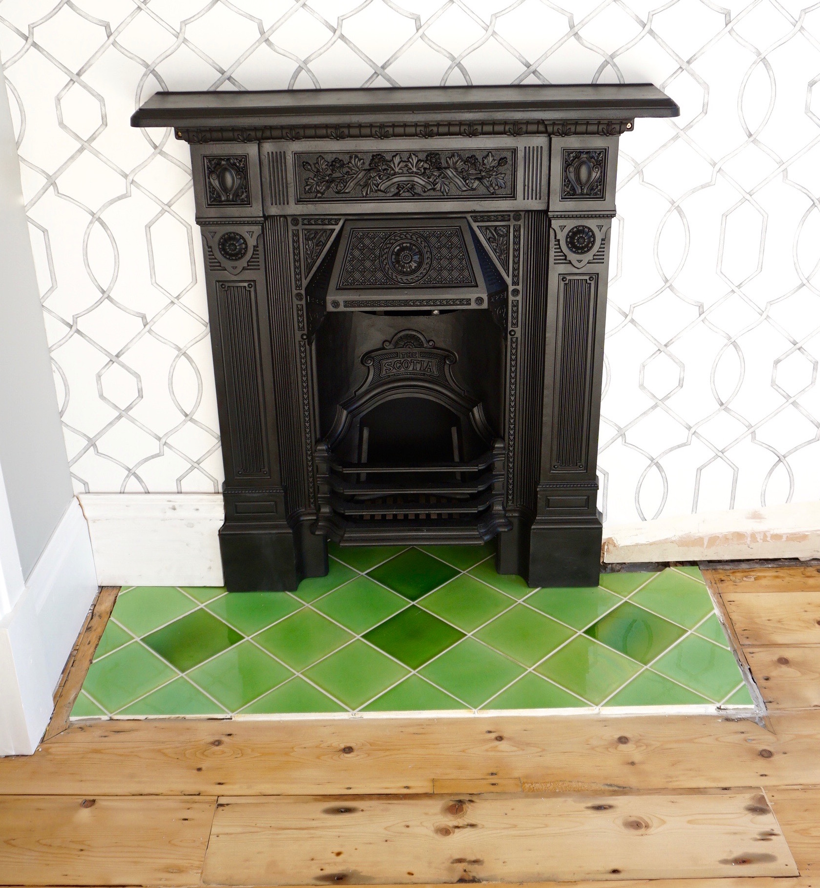 DSC05720 Green reclaimed gloss tiles in Edwardian fireplace with black cast iron surround